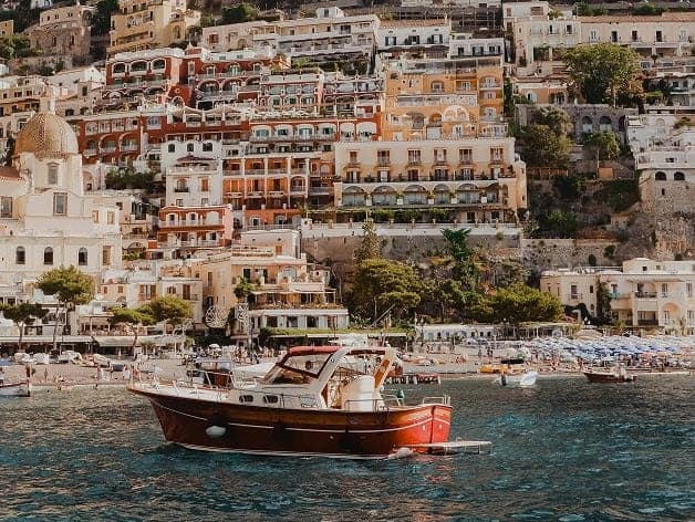 An image of a small yacht on water