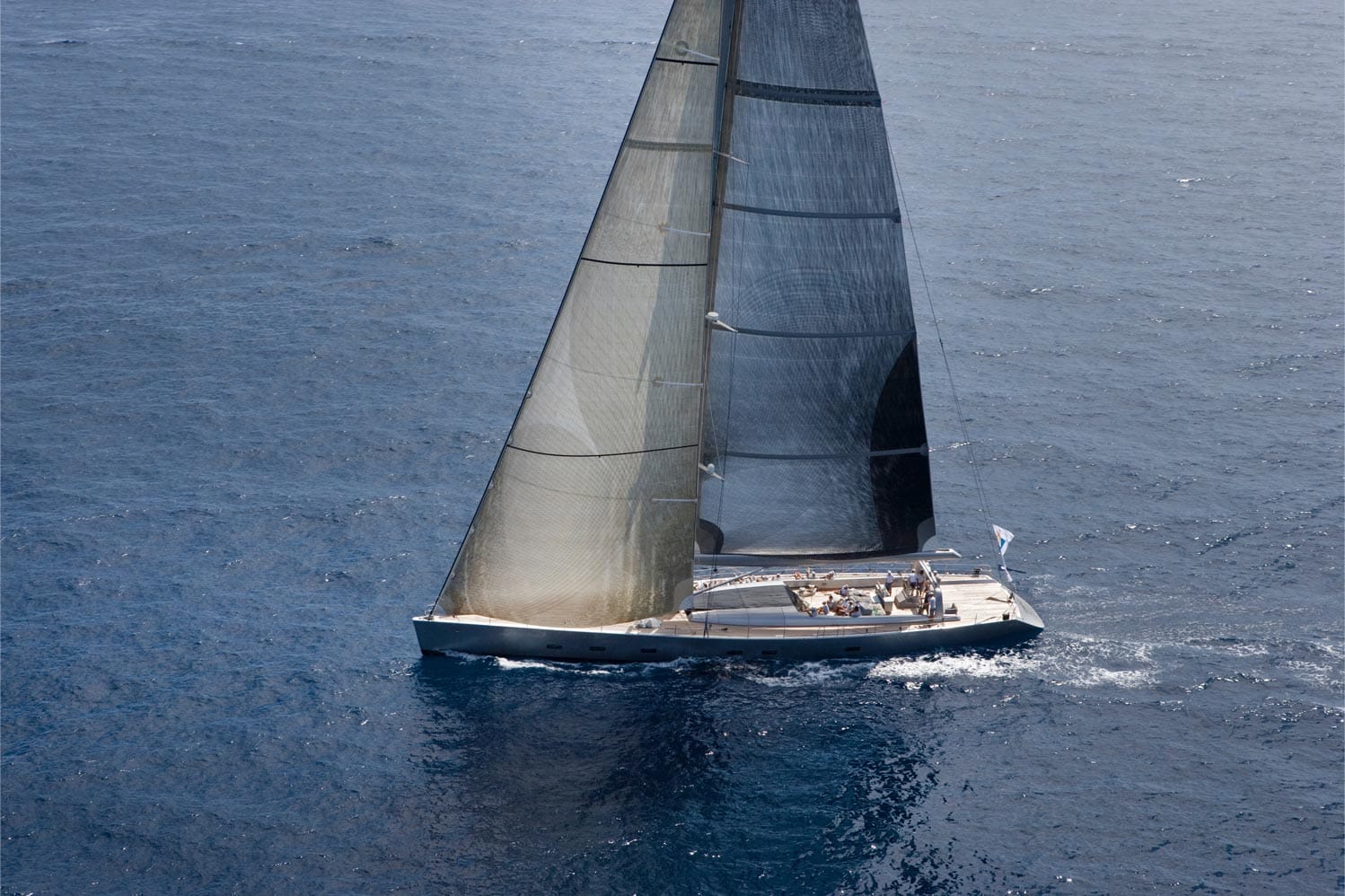 An image of a yacht sailing in sea.